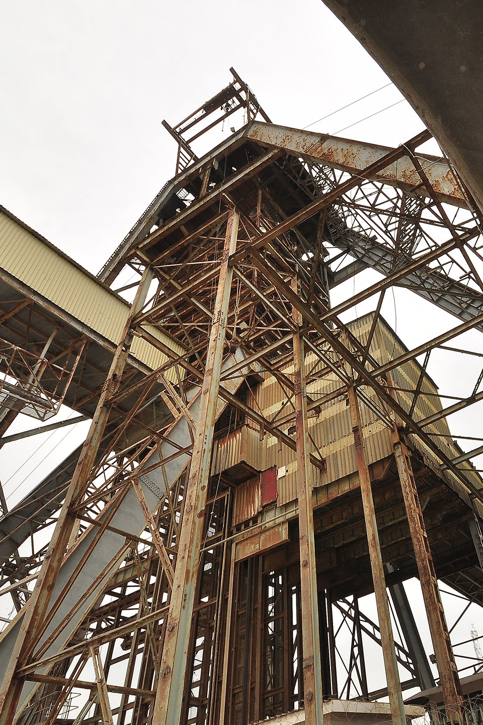 A large structure with many wooden supports and metal beams.